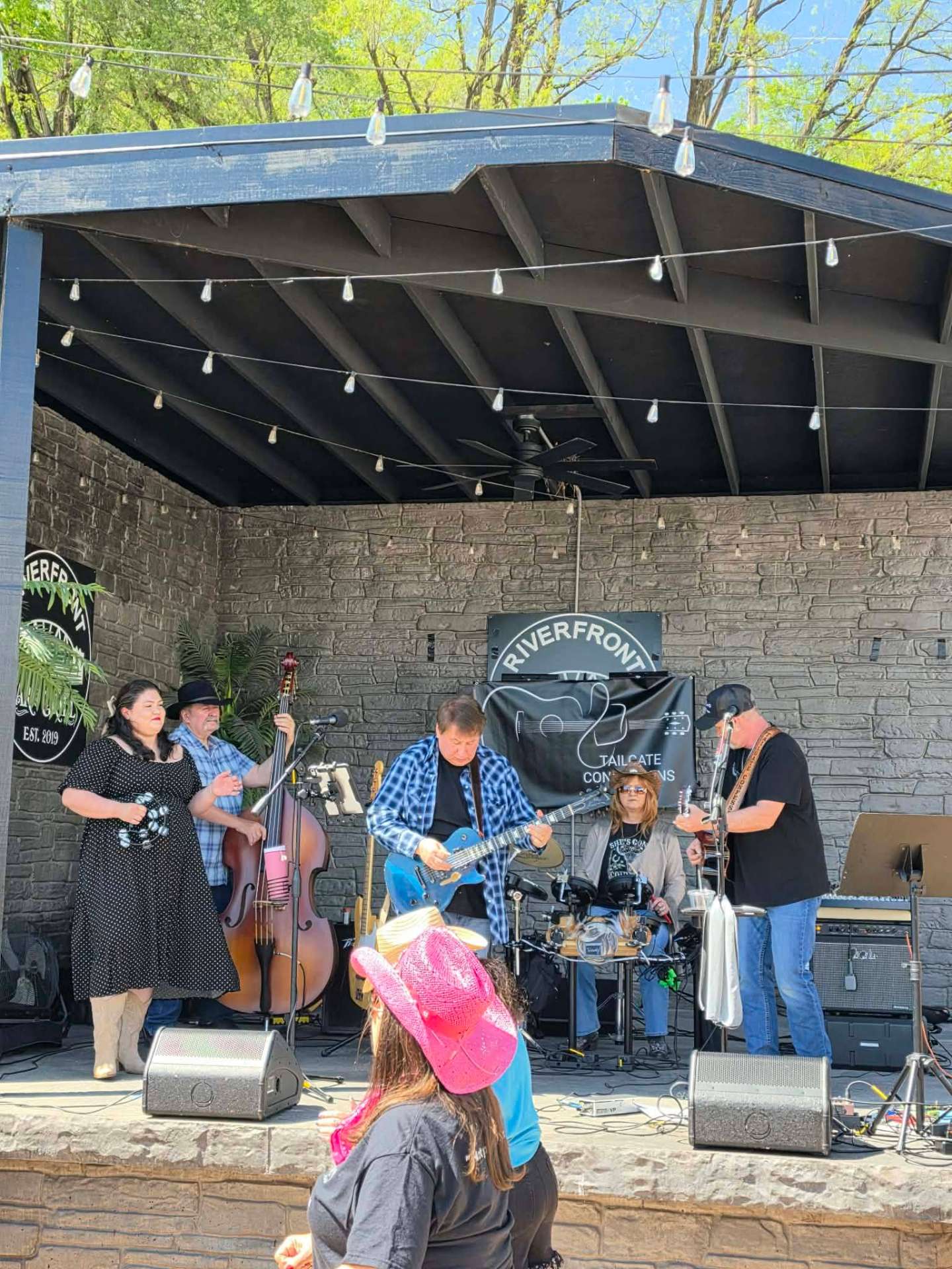Full band performing at Riverfront